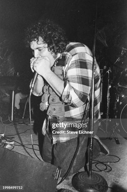 American Rock musician John Popper, of the band Blues Traveler, plays harmonica as he performs on stage at the 712 Club, New York, New York, April 9,...