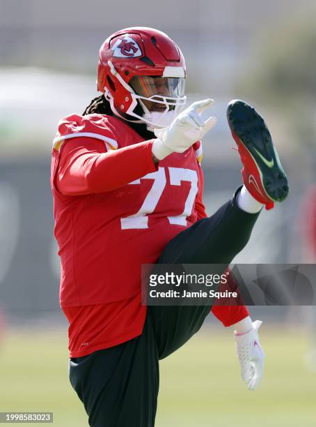 Offensive tackle Lucas Niang stretches during Kansas City Chiefs practice ahead of Super Bowl LVIII at the Las Vegas Raiders...