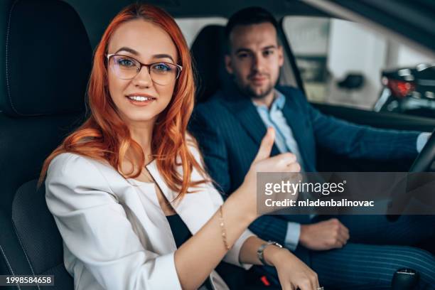 beautiful couple buying a new car - business mature couple portrait stock pictures, royalty-free photos & images