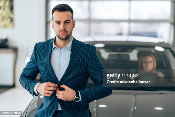beautiful couple buying a new car - business mature couple portrait stock pictures, royalty-free photos & images