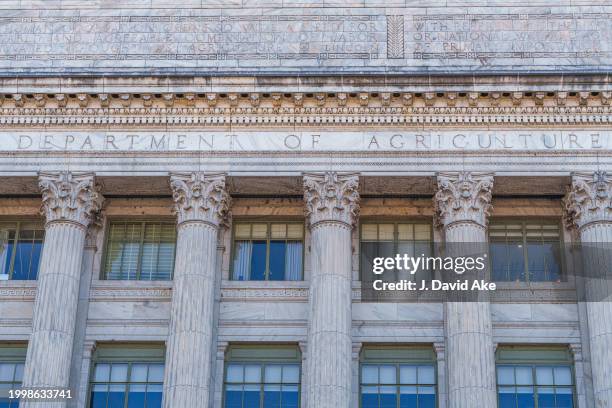 The Department of Agriculture is seen carved into the stone above the pillared entrance to the US Department of Agriculture headquarters building on...