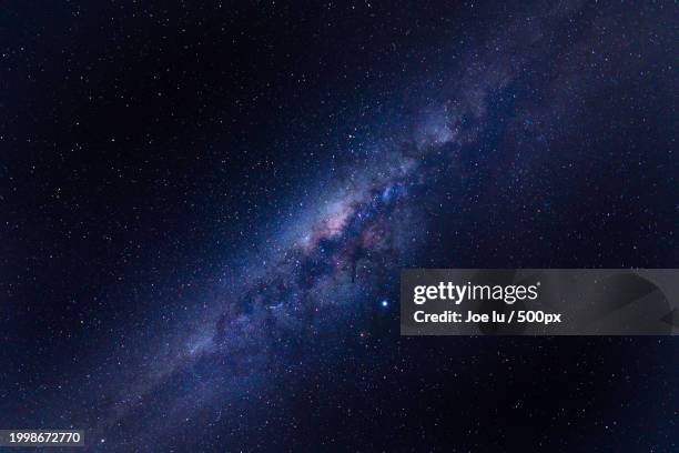 low angle view of stars in sky at night - nebulosa bildbanksfoton och bilder