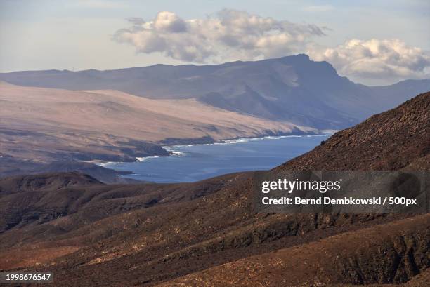 scenic view of mountains against sky - bernd dembkowski stock-fotos und bilder