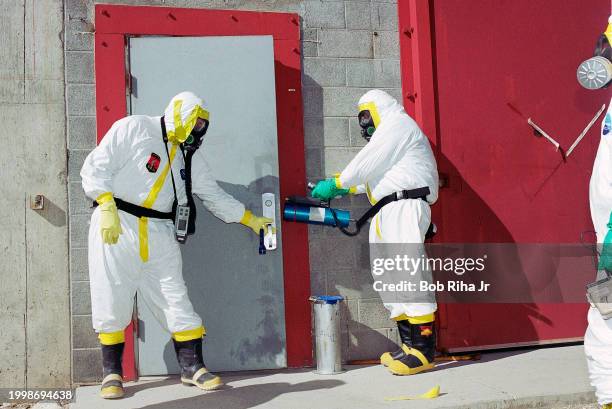 Public Safety First Responders from various United State, state and local agencies wear hazardous materials protective suits during training exercise...