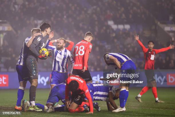 Barry Bannan of Sheffield Wednesday celebrates with James Beadle after he makes a safe during the Sky Bet Championship match between Sheffield...