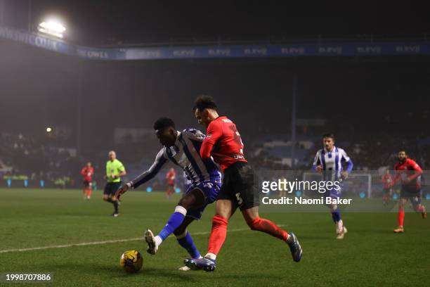 Anthony Musaba of Sheffield Wednesday battles for possession with Lee Buchanan of Birmingham City during the Sky Bet Championship match between...