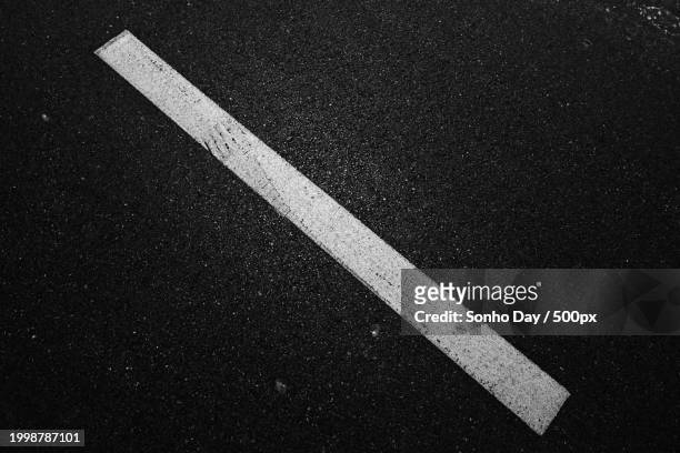 high angle view of markings on road - sonho stock pictures, royalty-free photos & images