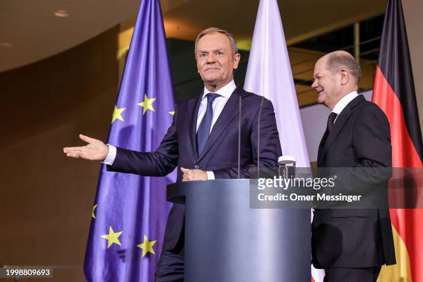 German Chancellor Olaf Scholz and Polish Prime Minister Donald Tusk leave following a joint press conference at the Chancellery on February 12, 2024...