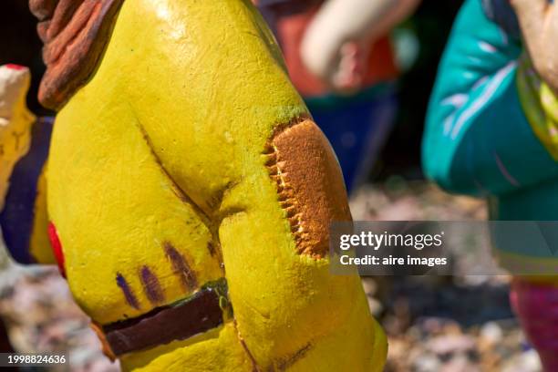 close up of a garden dwarf with a gray beard and colorful clothes, on a sunny day - yellow belt stock pictures, royalty-free photos & images