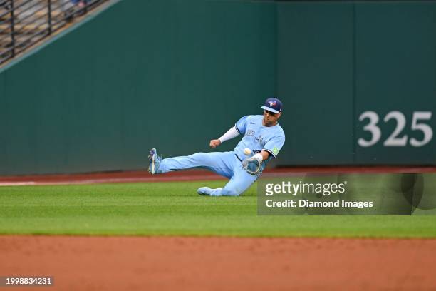 Whit Merrifield of the Toronto Blue Jays fields a fly ball during the third inning against the Cleveland Guardians at Progressive Field on August 9,...