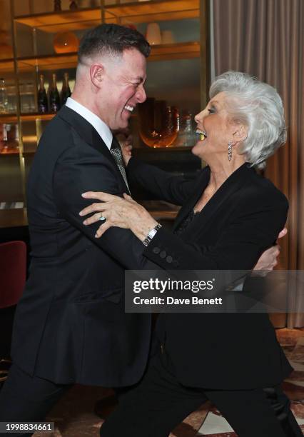 Kai Widdrington and Angela Rippon dance at a drinks reception hosted by Angela Rippon to celebrate her time on Strictly Come Dancing and the end of...