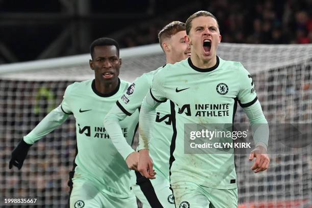 Chelsea's English midfielder Conor Gallagher celebrates after scoring their first goal during the English Premier League football match between...