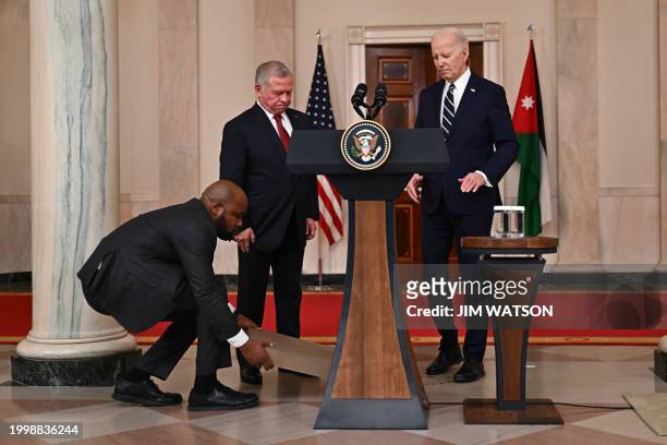 King Abdullah II of Jordan walks to the lectern to speak after meeting with US President Joe Biden in the Cross Hall of the White House in...