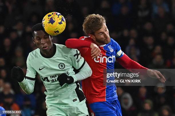 Chelsea's Senegalese striker Nicolas Jackson fails to get this header on target under pressure from Crystal Palace's Danish defender Joachim Andersen...
