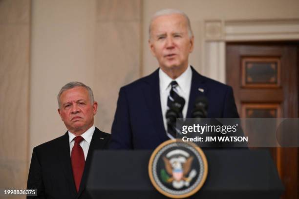 King Abdullah II of Jordan looks on as US President Joe Biden speaks in the Cross Hall of the White House in Washington, DC, on February 12, 2024....