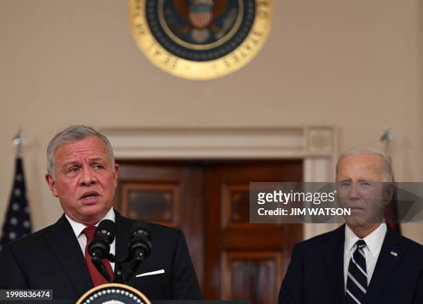 King Abdullah II of Jordan speaks to the press as US President Joe Biden looks on in the Cross Hall of the White House in Washington, DC, on February...