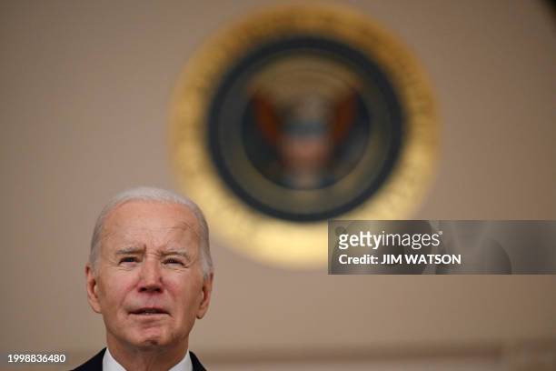 President Joe Biden speaks after meeting with King Abdullah II of Jordan in the Cross Hall of the White House in Washington, DC, on February 12,...