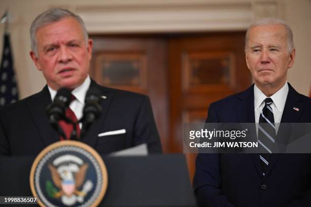 King Abdullah II of Jordan speaks as US President Joe Biden looks on in the Cross Hall of the White House in Washington, DC, on February 12, 2024....