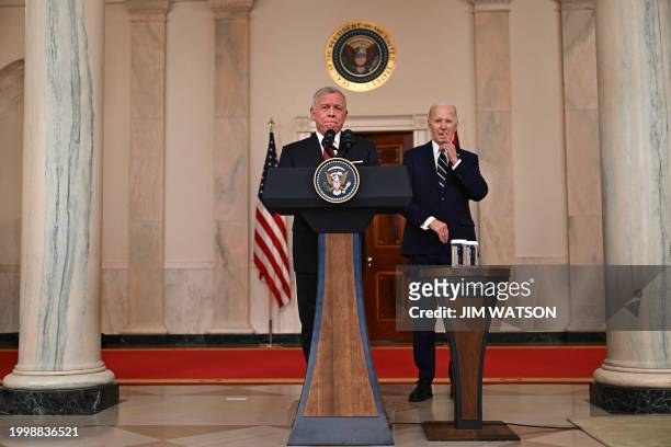 King Abdullah II of Jordan speaks as US President Joe Biden looks on in the Cross Hall of the White House in Washington, DC, on February 12, 2024....