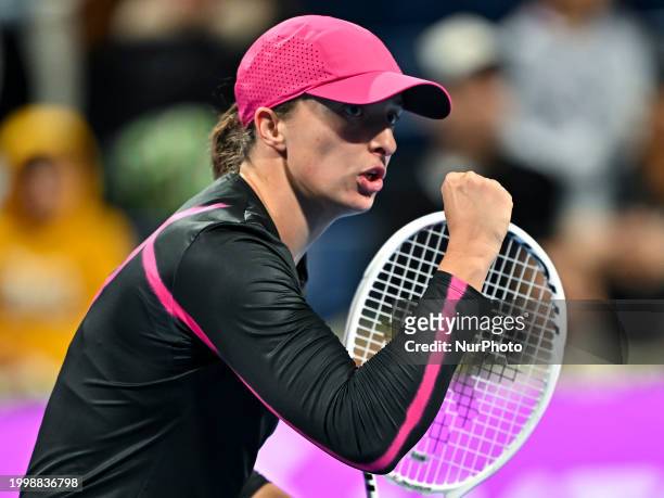 Iga Swiatek of Poland is reacting during her second-round match against Sorana Cirstea of Romania at the WTA 1000-Qatar TotalEnergies Open tennis...