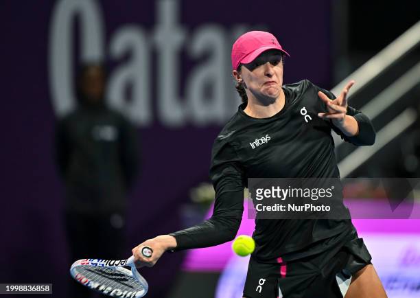 Iga Swiatek of Poland is playing in her second-round match against Sorana Cirstea of Romania at the WTA 1000-Qatar TotalEnergies Open tennis...