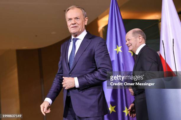 German Chancellor Olaf Scholz and Polish Prime Minister Donald Tusk leave following a joint press conference at the Chancellery on February 12, 2024...