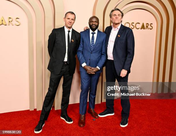 John Battsek, Moses Bwayo and Christopher Sharp at the 96th Oscars Nominee Luncheon at the Beverly Hilton on February 12, 2024 in Beverly Hills,...