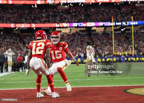 Kansas City Chiefs quarterback Patrick Mahomes lifts wide receiver Mecole Hardman Jr. Celebrate after he scored the winning touchdown in overtime to...