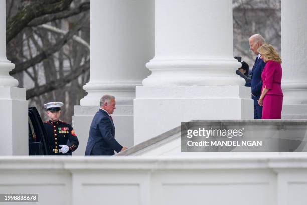 President Joe Biden and First Lady Jill Biden greet Jordan's King Abdullah II upon his arrival at the North Portico of the White House in Washington,...