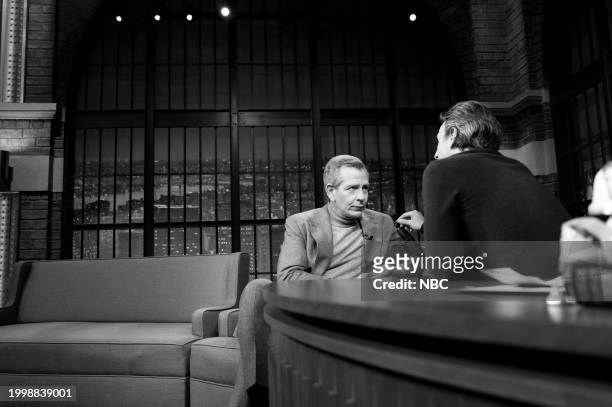 Episode 1484 -- Pictured: Actor Ben Mendelsohn talks with host Seth Meyers during a commercial break on February 12, 2024 --