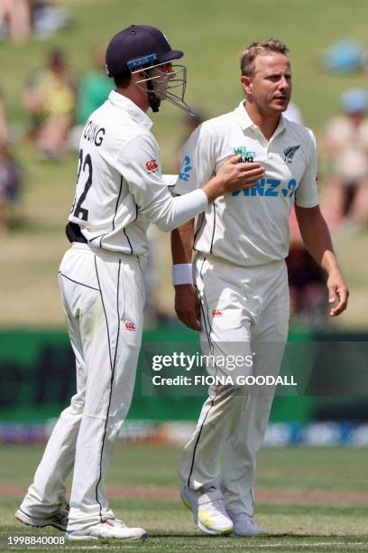 New Zealand's Neil Wagner reacts with teammate Will Young on day one of the second Test cricket match between New Zealand and South Africa at Seddon...