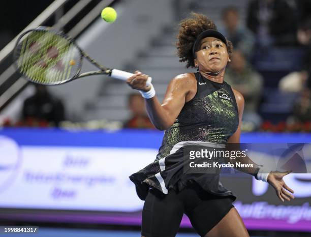 Japan's Naomi Osaka plays against Caroline Garcia of France in the women's singles first round of the Qatar Open tennis tournament in Doha, Qatar, on...