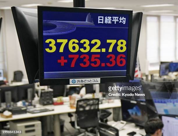 Stock monitor at a financial company in Tokyo shows the 225-issue Nikkei Stock Average rising more than 700 points from the previous day's close on...