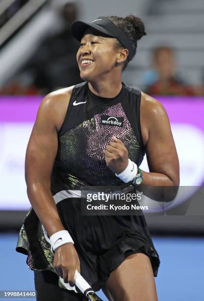 Japan's Naomi Osaka reacts after beating Caroline Garcia of France in the women's singles first round at the Qatar Open tennis tournament in Doha,...