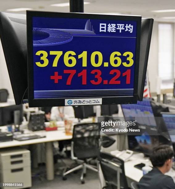 Stock monitor at a financial company in Tokyo shows the 225-issue Nikkei Stock Average rising more than 700 points from the previous day's close on...