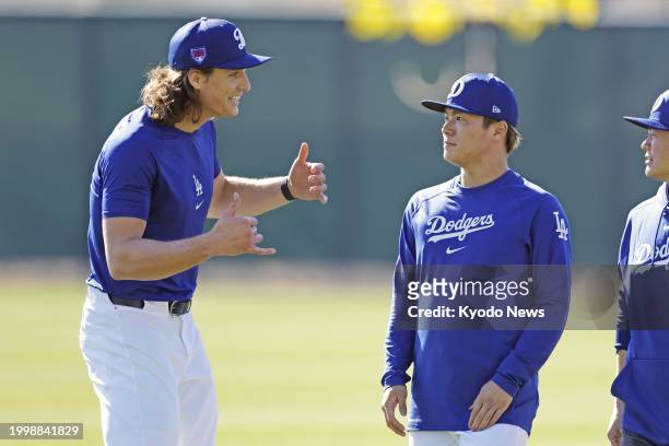 Yoshinobu Yamamoto chats with Tyler Glasnow at spring training with the Los Angeles Dodgers in Glendale, Arizona, on Feb. 12, 2024.