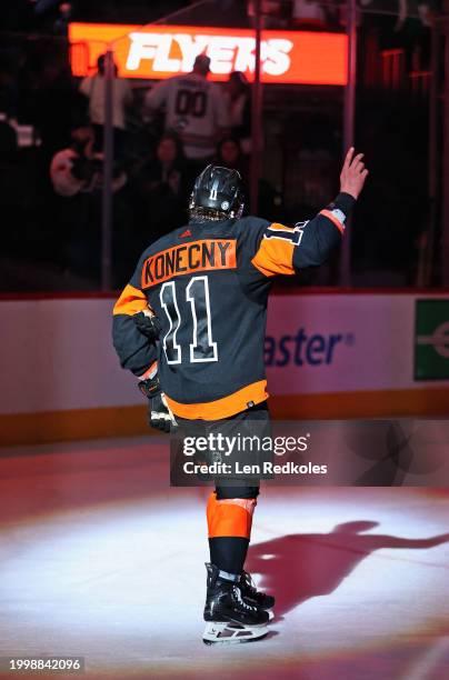 Travis Konecny of the Philadelphia Flyers acknowledges the crowd after being named one of the three stars of the game against the Arizona Coyotes at...