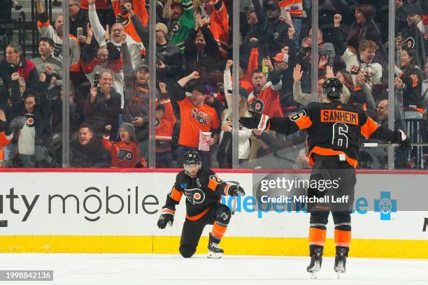 Scott Laughton and Travis Sanheim of the Philadelphia Flyers react after a goal by Laughton against the Arizona Coyotes in the third period at the...