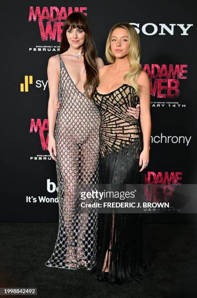 Actress Dakota Johnson and US actress Sydney Sweeney arrive for the premiere of Sony's "Madame Web" in Los Angeles, California, on February 12, 2024.