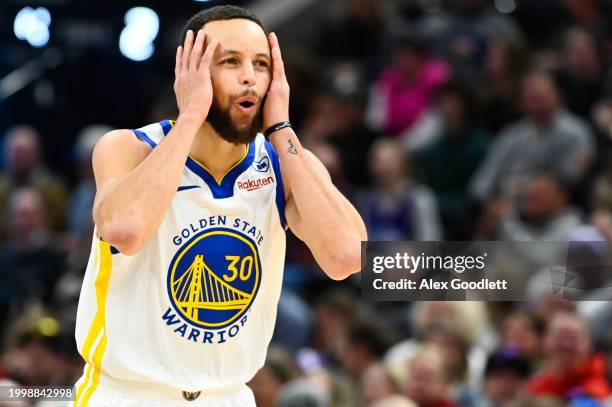 Stephen Curry of the Golden State Warriors celebrates a three-point basket during the second half against the Utah Jazz at Delta Center on February...