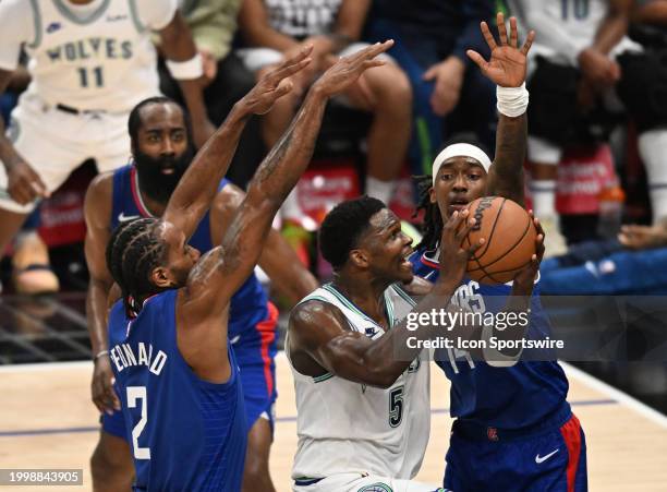 Minnesota Timberwolves Guard Anthony Edwards drives past Los Angeles Clippers Forward Kawhi Leonard Terance Mann during a NBA basketball game at the...