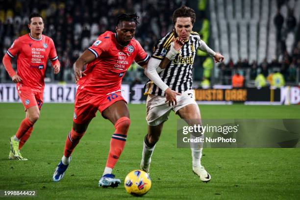 Udinese forward Gerard Deulofeu is fighting for the ball against Juventus forward Federico Chiesa during the Serie A football match number 24 between...