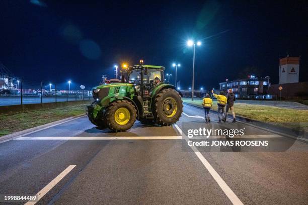 Farmers and their tractors take part in a protest called by several unions, near quai 730 in the port of Antwerp on February 13, 2024. Farmers...