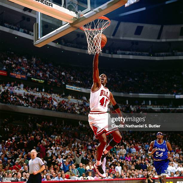 Michael Jordan of the Chicago Bulls takes an open layup against the Orlando Magic during the NBA game at the United Center on March 24, 1995 in...