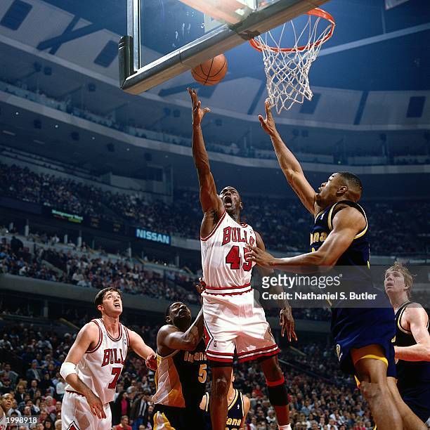 Michael Jordan of the Chicago Bulls takes a layup against the Indiana Pacers during the NBA game at the United Center on April 11, 1995 in Chicago,...