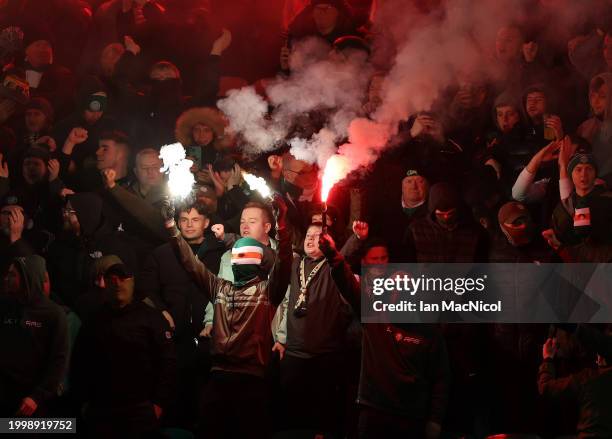 Celtic fans are seen with flares during the Cinch Scottish Premiership match between Hibernian FC and Celtic FC at Easter Road on February 07, 2024...