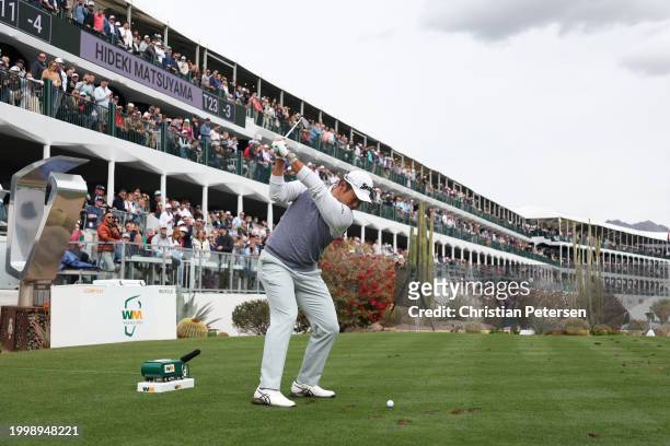 Hideki Matsuyama of Japan plays his shot from the 16th tee during the second round of the WM Phoenix Open at TPC Scottsdale on February 09, 2024 in...