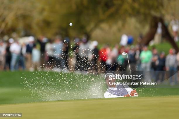 Hideki Matsuyama of Japan plays a shot from a bunker on the 15th hole during the second round of the WM Phoenix Open at TPC Scottsdale on February...