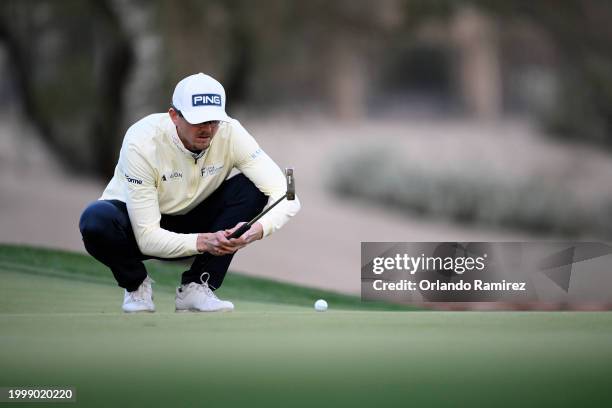 Jim Knous of the United States lines up a putt on the third green during the second round of the WM Phoenix Open at TPC Scottsdale on February 09,...