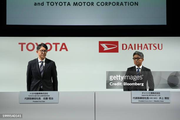 Koji Sato, president of Toyota Motor Corp., left, and Masahiro Inoue, incoming chief executive officer of Daihatsu Motor Co., attend a news...